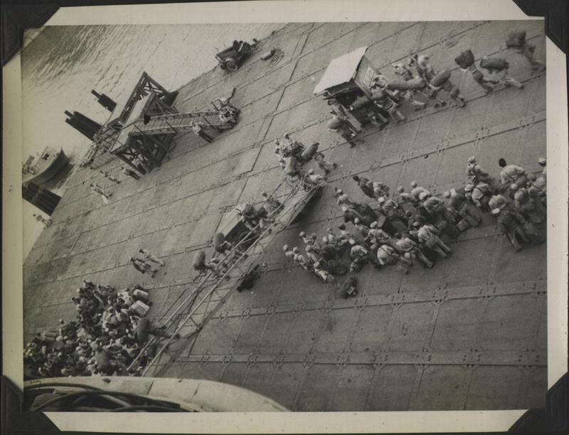 WWII PI Going home people on pier